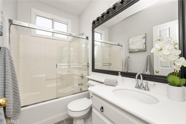 10108 Marchant Ave, Tustin, CA 92782 - bathroom featuring vanity, bath / shower combo with glass door, and toilet