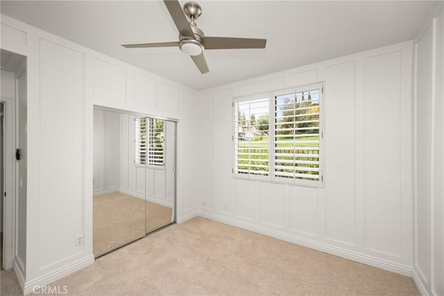 10108 Marchant Ave, Tustin, CA 92782 - unfurnished bedroom featuring a decorative wall, light carpet, and ceiling fan