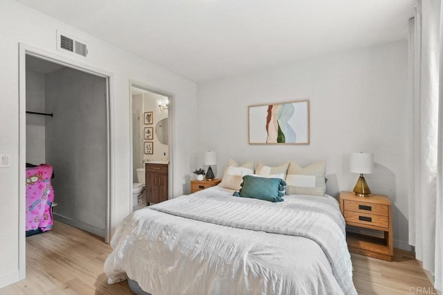 5377 Lake Murray Blvd, La Mesa, CA 91942 - bedroom featuring light wood-type flooring, connected bathroom, and baseboards