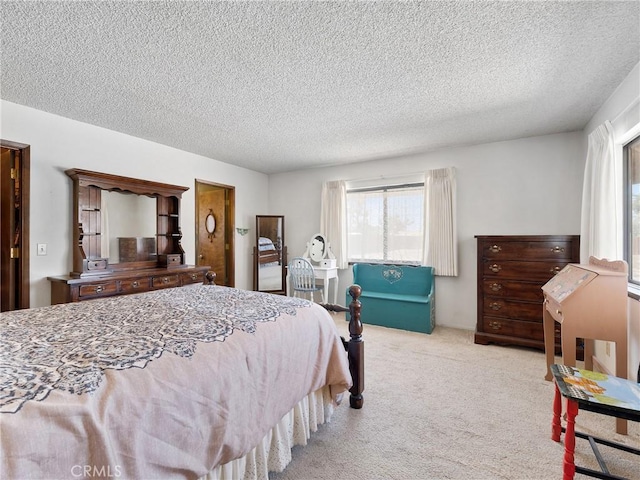 20654 Ottawa Rd, Apple Valley, CA 92308 - bedroom with multiple windows, a textured ceiling, and carpet floors