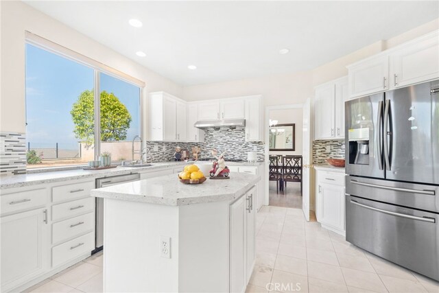 18559 Stonegate Ln, Rowland Heights, CA 91748 - kitchen with stainless steel appliances, backsplash, light tile patterned flooring, white cabinetry, and recessed lighting