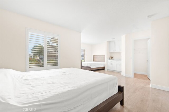 18559 Stonegate Ln, Rowland Heights, CA 91748 - bedroom with a spacious closet, baseboards, and light wood-style flooring