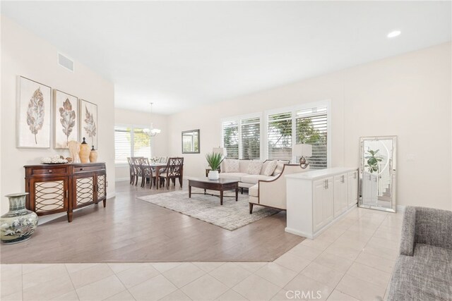 18559 Stonegate Ln, Rowland Heights, CA 91748 - living area featuring a chandelier, baseboards, and light wood-type flooring