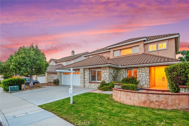 18559 Stonegate Ln, Rowland Heights, CA 91748 - view of front facade featuring stone siding, concrete driveway, a tile roof, an attached garage, and a front lawn