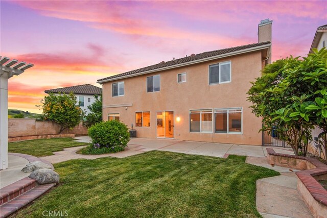 18559 Stonegate Ln, Rowland Heights, CA 91748 - rear view of house featuring a chimney, a patio, stucco siding, and a tile roof