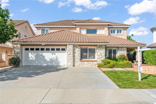 18559 Stonegate Ln, Rowland Heights, CA 91748 - mediterranean / spanish-style house featuring stone siding, a tiled roof, a garage, driveway, and stucco siding