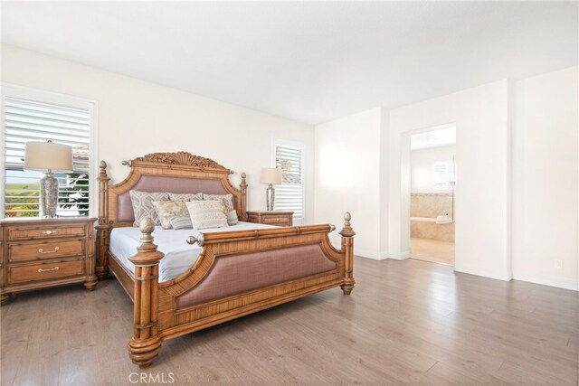 18559 Stonegate Ln, Rowland Heights, CA 91748 - bedroom with wood finished floors, baseboards, and ensuite bath