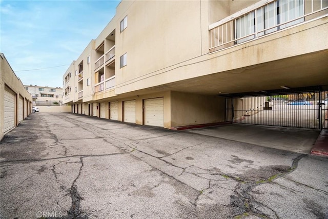10149 Commerce Ave Unit 8, Tujunga, CA 91042 - view of asphalt road featuring community garages