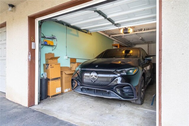 10149 Commerce Ave Unit 8, Tujunga, CA 91042 - garage featuring a garage door opener
