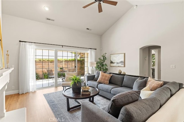 35 Veneto Cir, Chico, CA 95926 - living room with arched walkways, high vaulted ceiling, ceiling fan, and wood finished floors