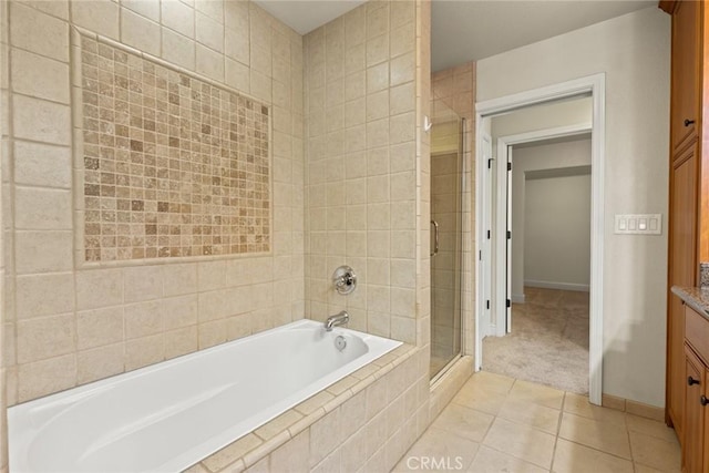 35 Veneto Cir, Chico, CA 95926 - bathroom featuring a shower stall, vanity, a garden tub, tile patterned flooring, and baseboards