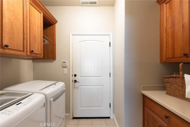 35 Veneto Cir, Chico, CA 95926 - washroom with cabinet space, washer and clothes dryer, light tile patterned flooring, and baseboards