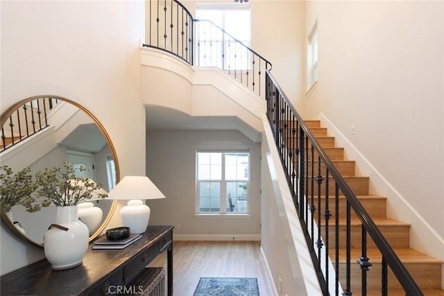 35 Veneto Cir, Chico, CA 95926 - stairs featuring wood finished floors, a towering ceiling, and baseboards