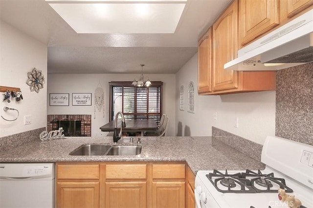 821 S Cerritos Ave Unit 17, Azusa, CA 91702 - kitchen featuring white appliances, under cabinet range hood, a sink, a brick fireplace, and a chandelier