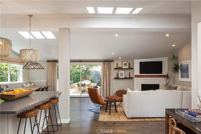 292 Bowling Green Dr, Costa Mesa, CA 92626 - living area featuring healthy amount of natural light, a skylight, a chandelier, and recessed lighting