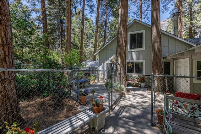 9091 Mountain View Dr, Forest Falls, CA 92339 - view of home's exterior featuring board and batten siding and a patio area