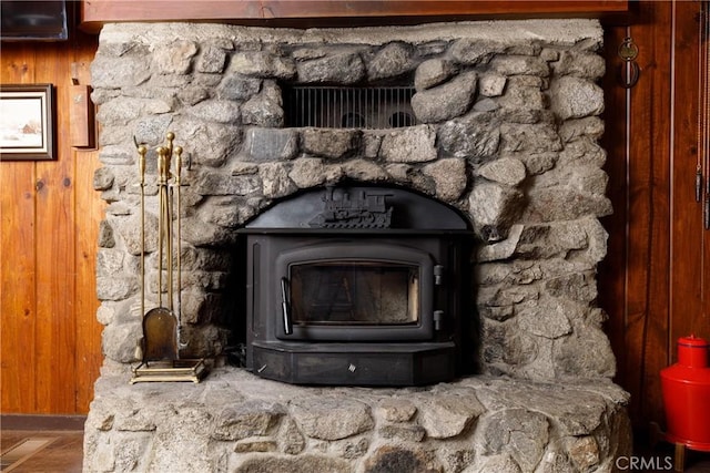 9091 Mountain View Dr, Forest Falls, CA 92339 - detailed view of a wood stove, baseboards, and wood walls