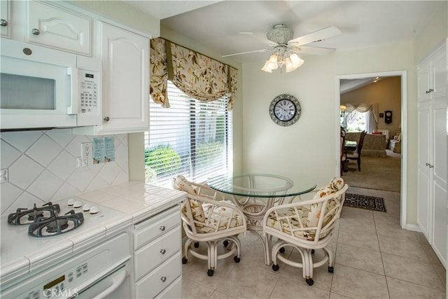 11 Jasmine Creek Ln, Laguna Hills, CA 92653 - dining room with a ceiling fan and light tile patterned floors