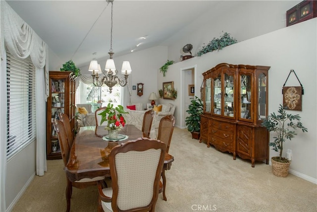 11 Jasmine Creek Ln, Laguna Hills, CA 92653 - dining space featuring lofted ceiling, light colored carpet, a chandelier, and baseboards