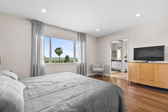 18534 Dylan St, Porter Ranch, CA 91326 - bedroom with wood finished floors, recessed lighting, and baseboards