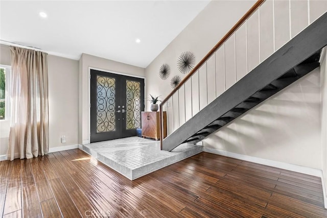 18534 Dylan St, Porter Ranch, CA 91326 - foyer entrance with french doors, wood-type flooring, baseboards, stairway, and recessed lighting