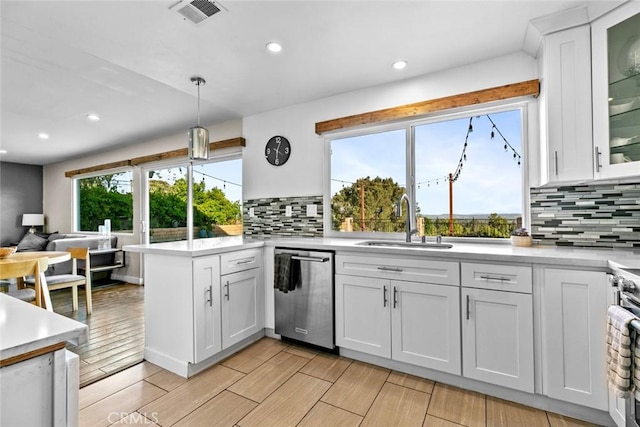 18534 Dylan St, Porter Ranch, CA 91326 - kitchen with dishwasher, a peninsula, a sink, recessed lighting, and light countertops