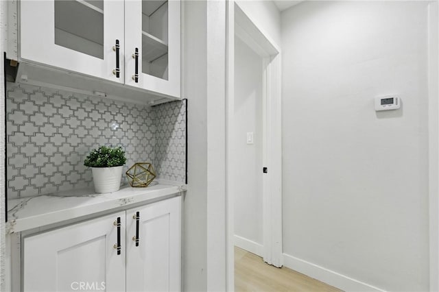 12632 Halcourt Ave, Norwalk, CA 90650 - interior space with backsplash, light wood-style floors, and baseboards