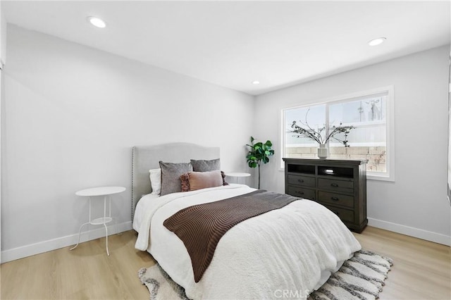 12632 Halcourt Ave, Norwalk, CA 90650 - bedroom with light wood finished floors, baseboards, and recessed lighting