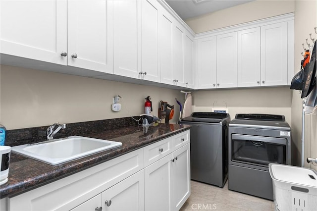 8640 Erika Ct, Atascadero, CA 93422 - laundry room with independent washer and dryer, cabinet space, and light tile patterned floors