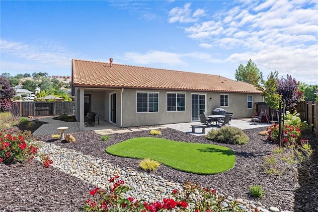 8640 Erika Ct, Atascadero, CA 93422 - rear view of property with a tile roof, a fenced backyard, a patio, and stucco siding