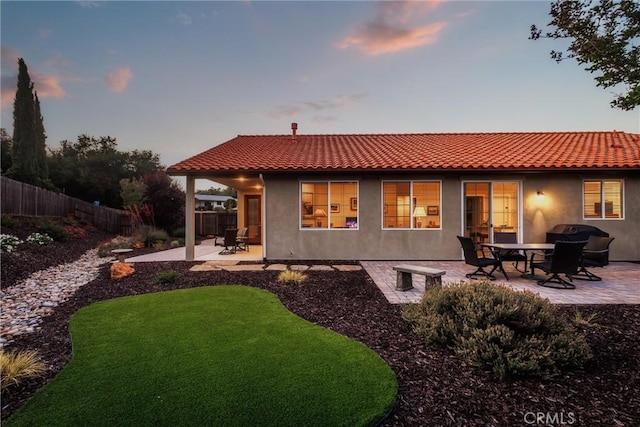 8640 Erika Ct, Atascadero, CA 93422 - back of property featuring a patio area, a fenced backyard, stucco siding, and a tile roof