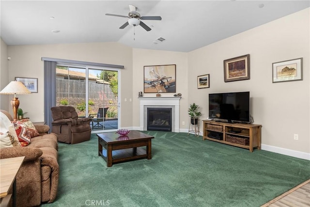 8640 Erika Ct, Atascadero, CA 93422 - carpeted living room with lofted ceiling, baseboards, a ceiling fan, and a glass covered fireplace