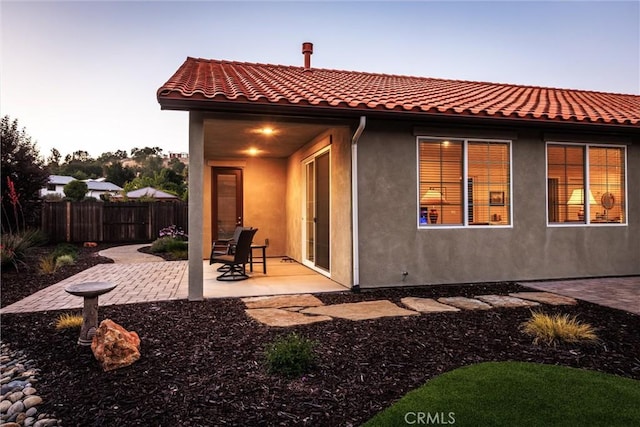 8640 Erika Ct, Atascadero, CA 93422 - rear view of house with a patio area, stucco siding, and a tiled roof