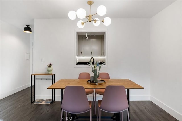 1222 N Olive Dr Unit 409, West Hollywood, CA 90069 - dining space with dark wood-style floors, a chandelier, and baseboards
