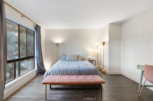 1222 N Olive Dr Unit 409, West Hollywood, CA 90069 - bedroom featuring baseboards and wood finished floors