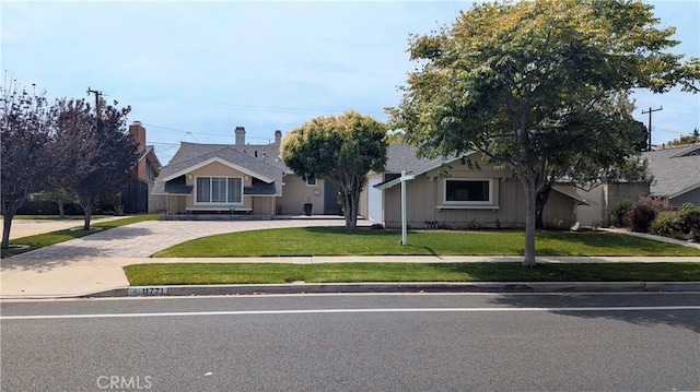 11771 Foster Rd, Rossmoor, CA 90720 - view of front of property with driveway and a front yard
