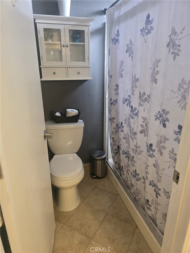 28151 Montecito Unit 36, Laguna Niguel, CA 92677 - bathroom with toilet, a stall shower, and tile patterned flooring