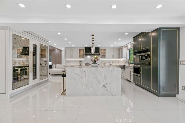 2223 Flintridge Dr, Glendale, CA 91206 - kitchen with wall oven, light stone counters, recessed lighting, light tile patterned floors, and glass insert cabinets