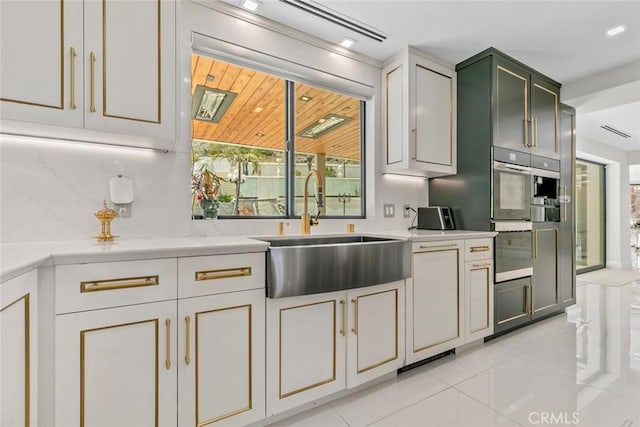 2223 Flintridge Dr, Glendale, CA 91206 - kitchen featuring a sink, light tile patterned floors, double oven, and backsplash