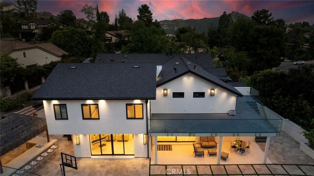 2223 Flintridge Dr, Glendale, CA 91206 - rear view of property with stucco siding and a patio