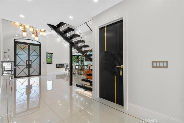 2223 Flintridge Dr, Glendale, CA 91206 - hall with tile patterned flooring, a chandelier, recessed lighting, baseboards, and stairway