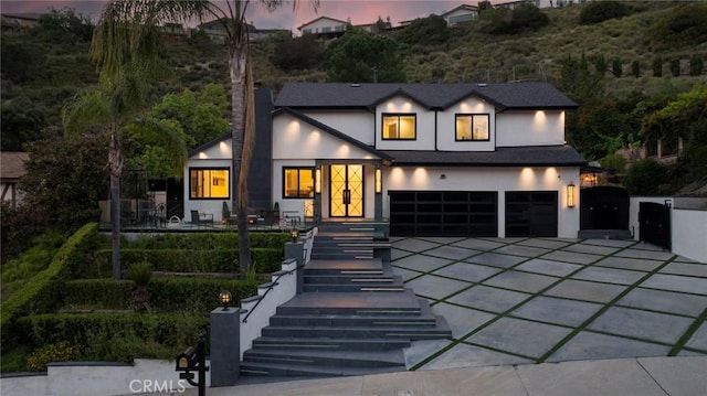 2223 Flintridge Dr, Glendale, CA 91206 - view of front facade with stucco siding, a garage, driveway, and a chimney