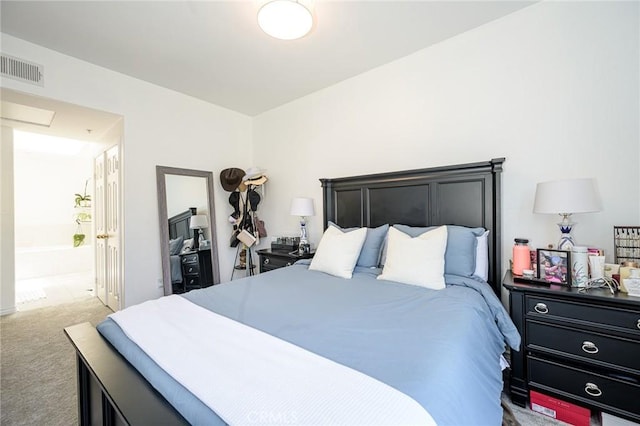 2233 Martin Unit 411, Irvine, CA 92612 - bedroom with light carpet and connected bathroom