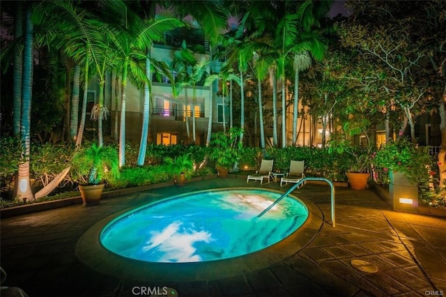 2233 Martin Unit 411, Irvine, CA 92612 - pool at twilight featuring a patio area