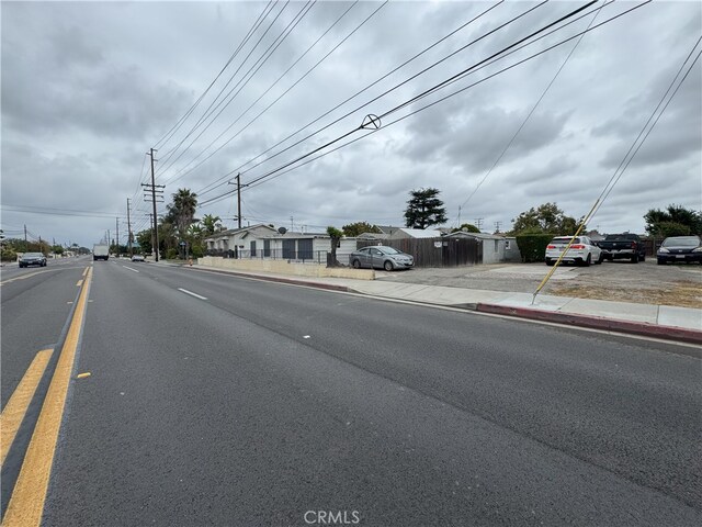 7232 W Cerritos Ave, Stanton, CA 90680 - view of asphalt road featuring sidewalks and curbs