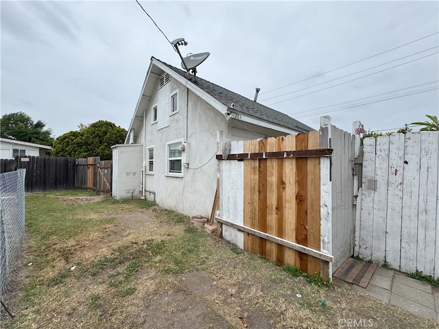 7232 W Cerritos Ave, Stanton, CA 90680 - view of property exterior with stucco siding and a shingled roof
