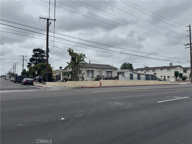7232 W Cerritos Ave, Stanton, CA 90680 - view of asphalt road featuring sidewalks and curbs