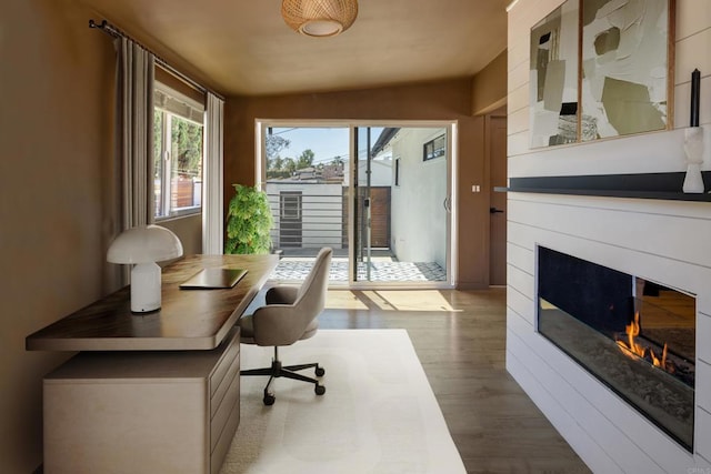 1958 Edgemont St, San Diego, CA 92102 - home office featuring a glass covered fireplace and wood finished floors