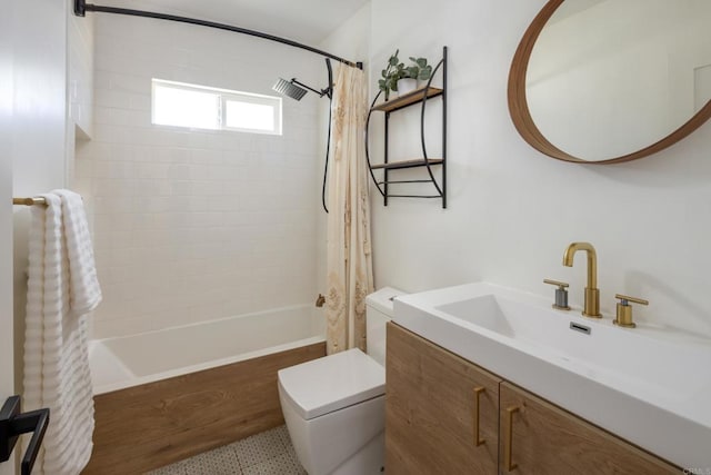 1958 Edgemont St, San Diego, CA 92102 - bathroom featuring shower / tub combo with curtain, toilet, vanity, and speckle patterned floor