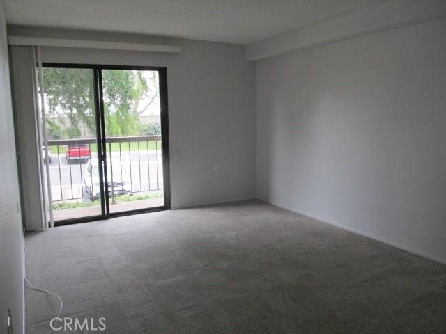 13601 Del Monte Dr Unit M17-46A, Seal Beach, CA 90740 - spare room featuring carpet and plenty of natural light